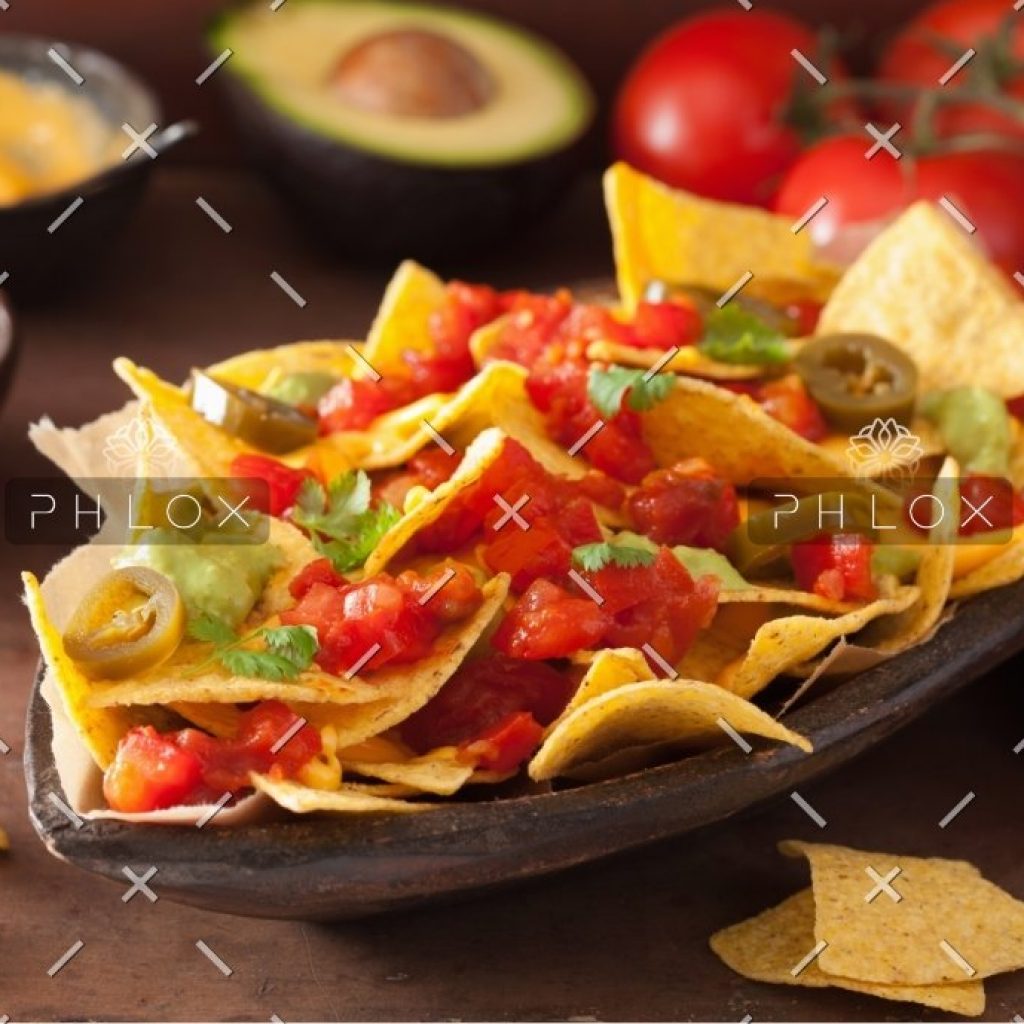 nachos-loaded-with-salsa-guacamole-cheese-and-P7GUFN7
